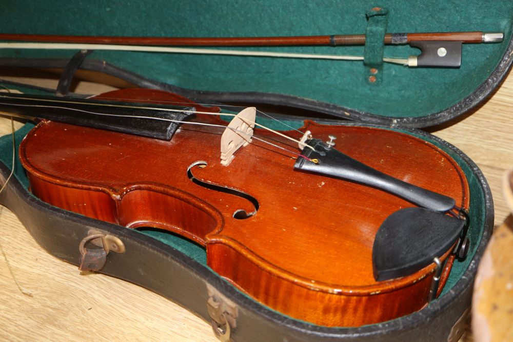 A 20th century Antonius Stradivarius Cremonensis violin, cased with two bows